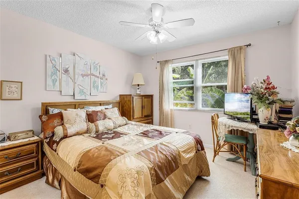 a bedroom with a bed and a table