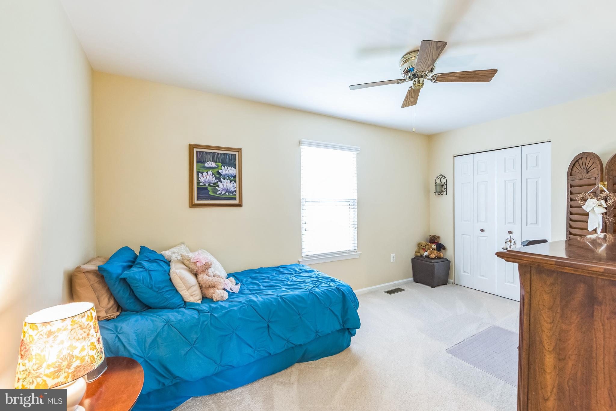 2902 Rosa Lane Norristown, PA 19403 - Photo 29 of 38 a bedroom with a bed and a chandelier