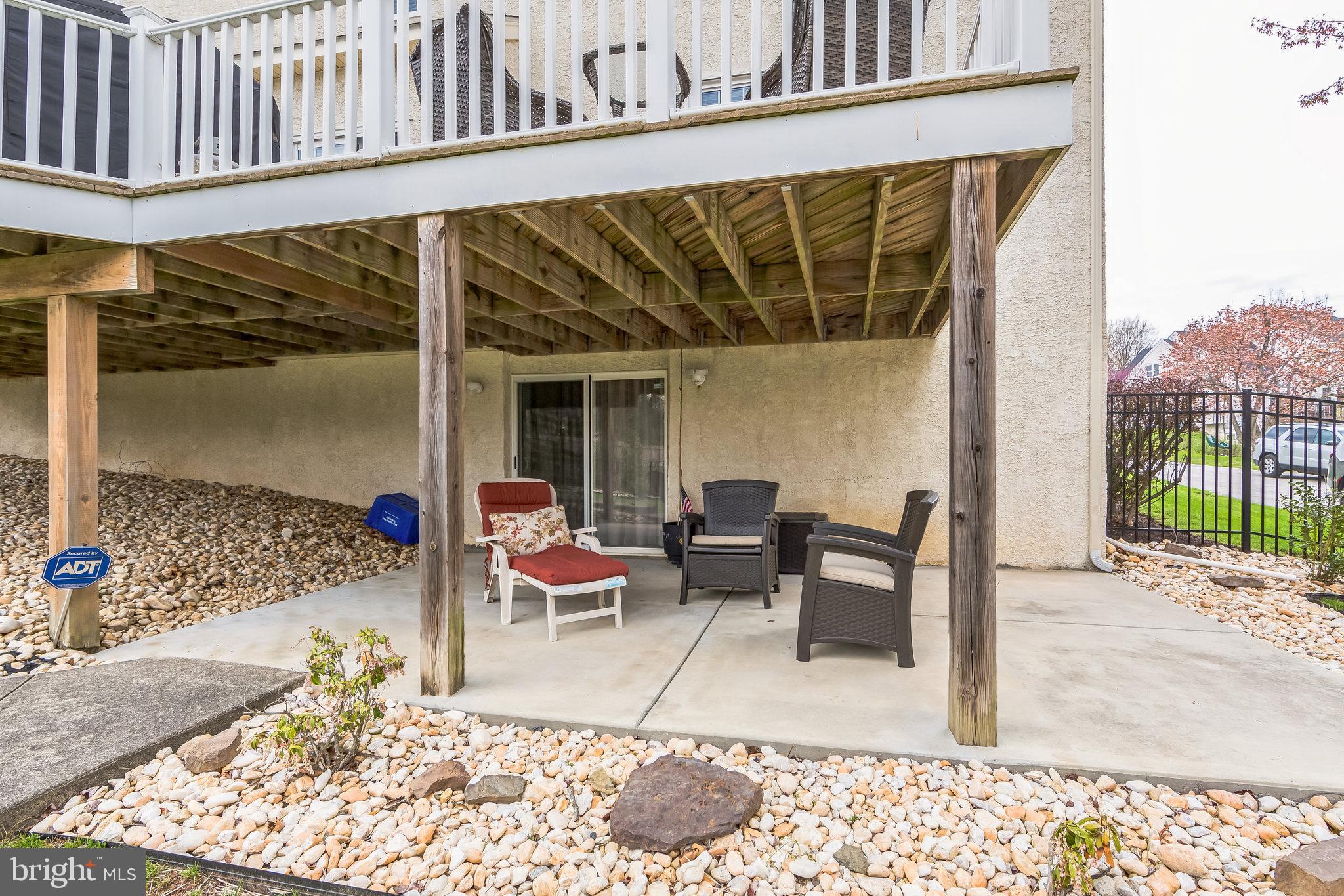 2902 Rosa Lane Norristown, PA 19403 - Photo 9 of 38 a view of a patio with a table and chairs and floor to ceiling window