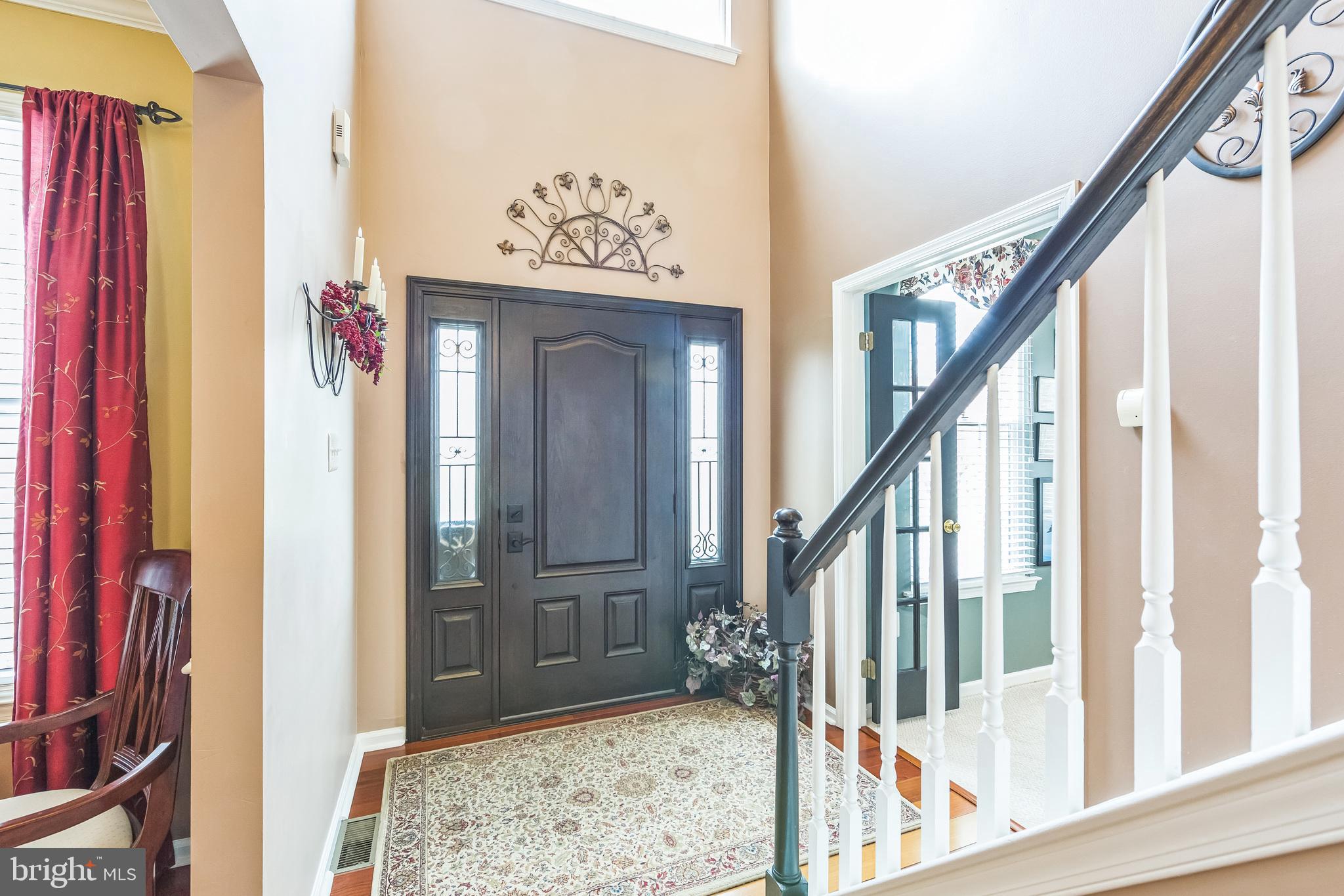 2902 Rosa Lane Norristown, PA 19403 - Photo 10 of 38 a view of a hallway with wooden floor and stairs