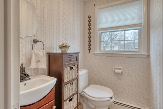a bathroom with a sink a toilet and tub