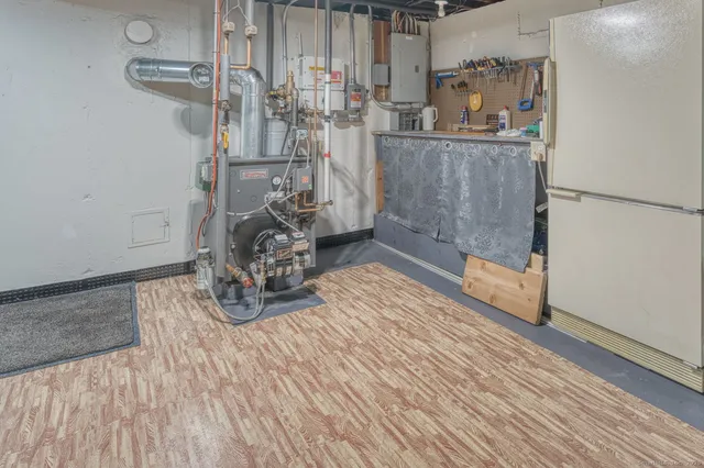 a room with hard wood floors and a sink
