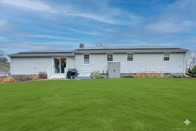 a front view of house with yard and porch