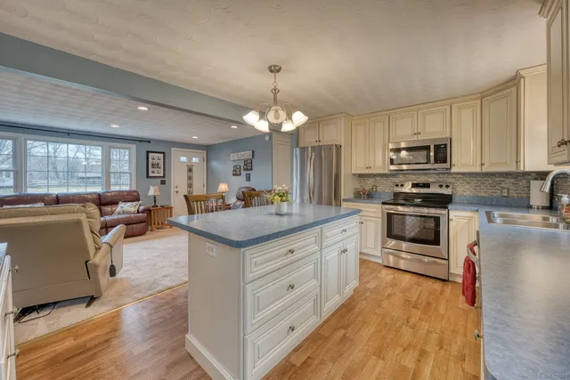 a kitchen with cabinets a sink and appliances