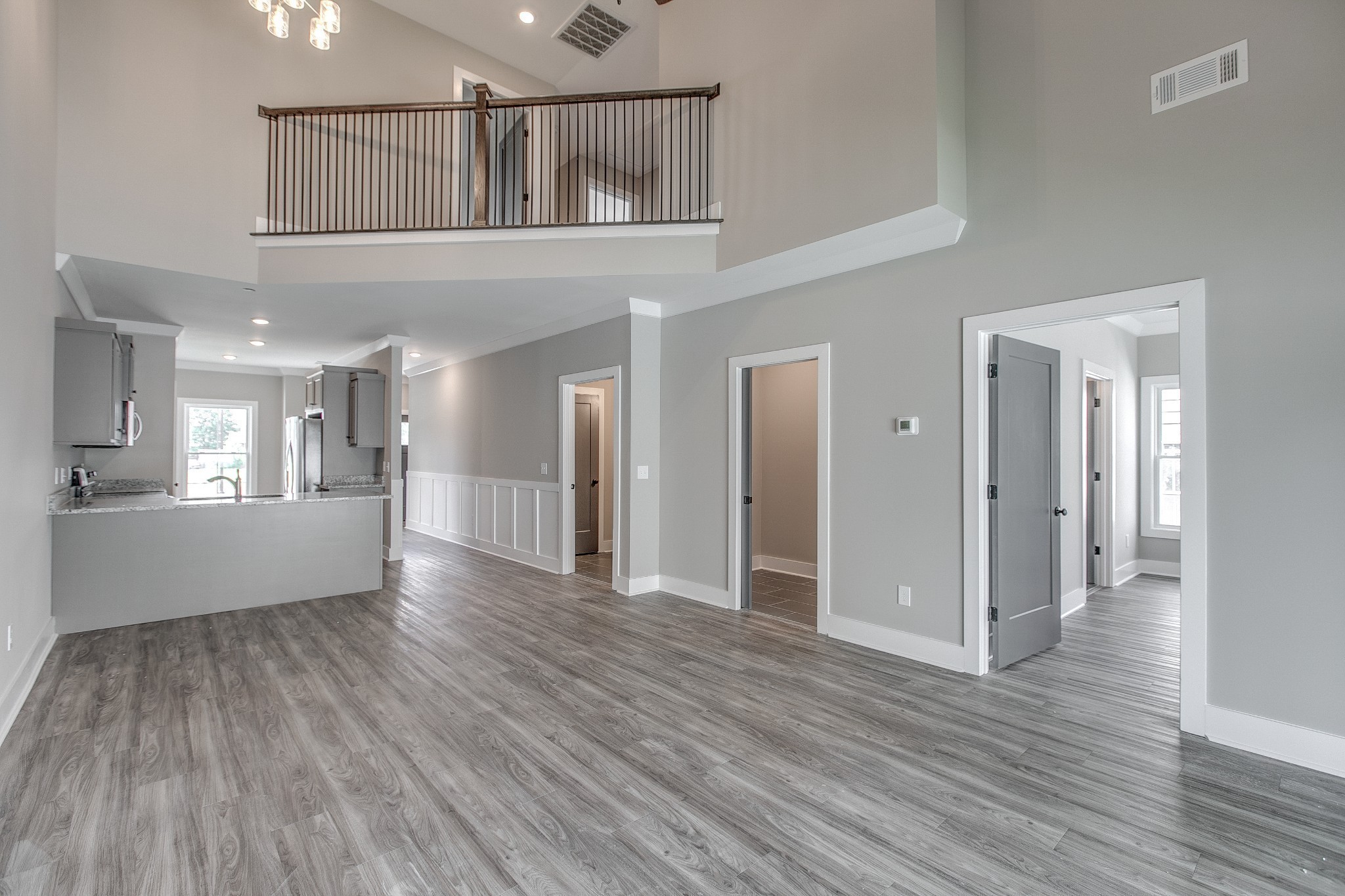 524 Haviture Way Murfreesboro, TN 37129 - Photo 15 of 50 a view of a big room with wooden floor and a kitchen