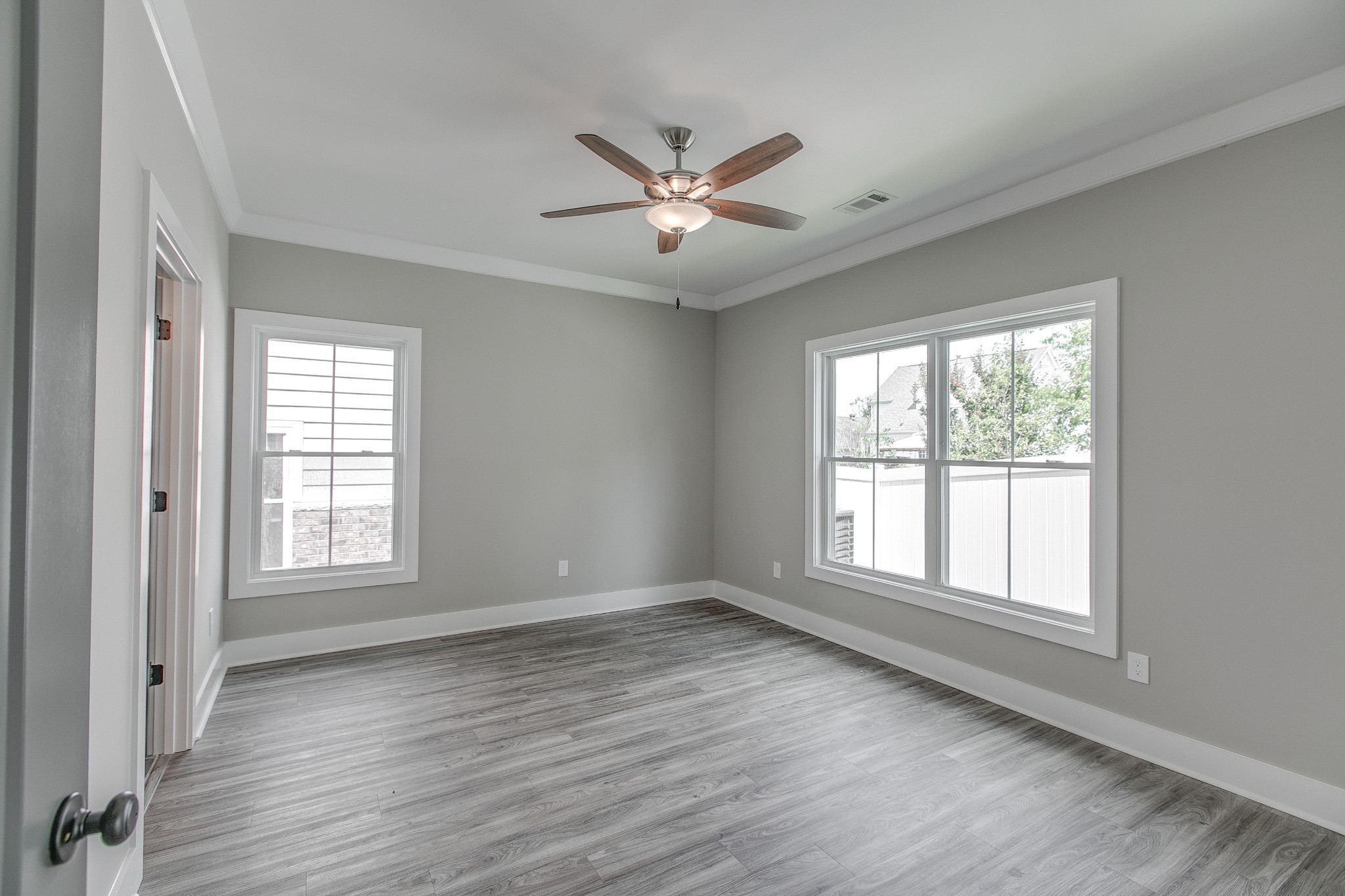 524 Haviture Way Murfreesboro, TN 37129 - Photo 16 of 50 a view of an empty room with wooden floor and a window
