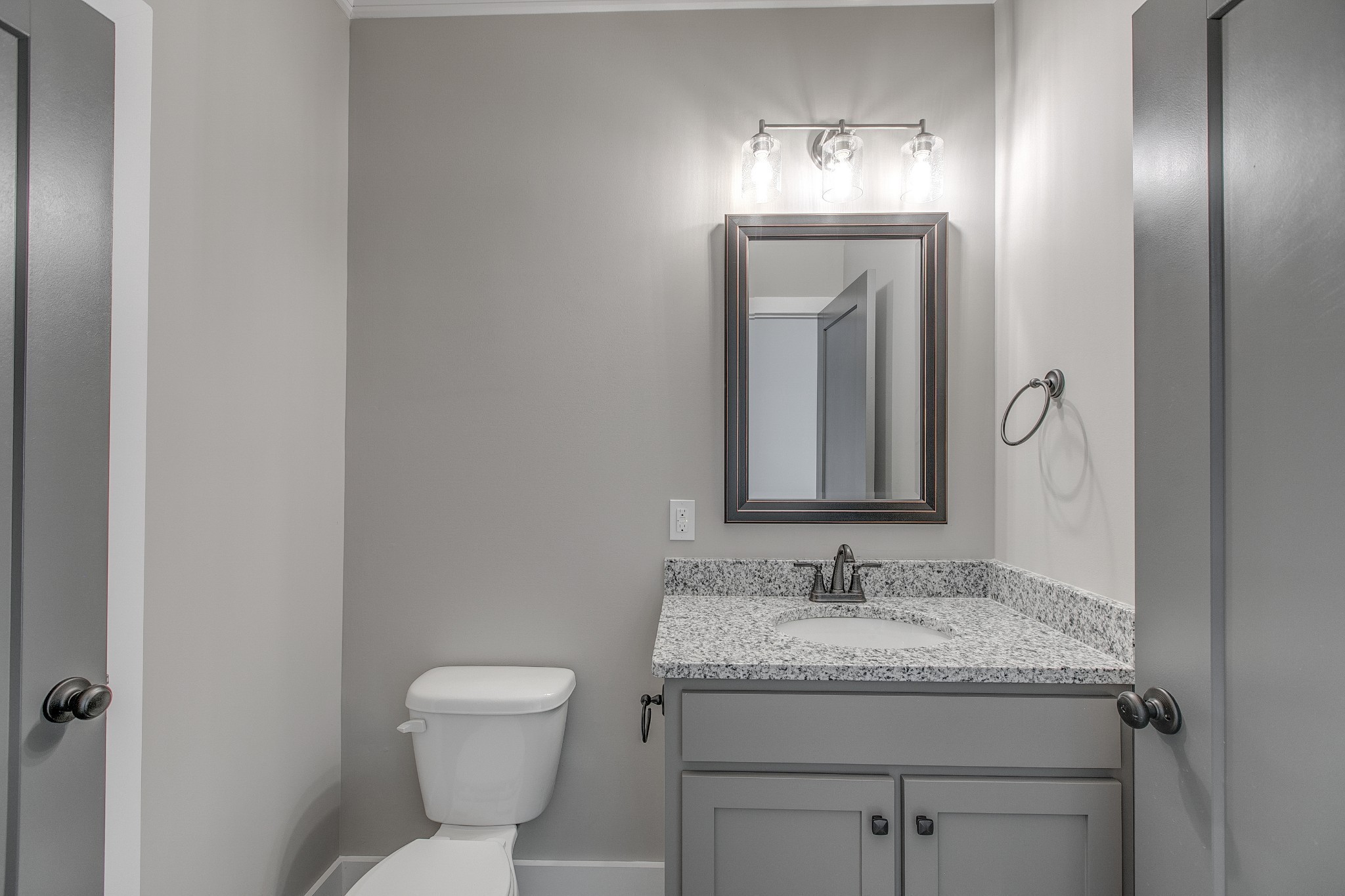 524 Haviture Way Murfreesboro, TN 37129 - Photo 29 of 50 a bathroom with a granite countertop sink a toilet and a mirror
