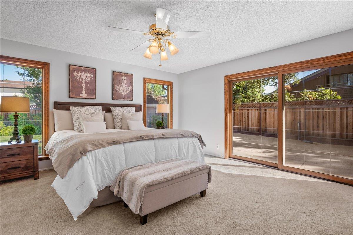 1816 Dry Creek Road San Jose, CA 95124 - Photo 16 of 37 a spacious bedroom with a bed and glass window