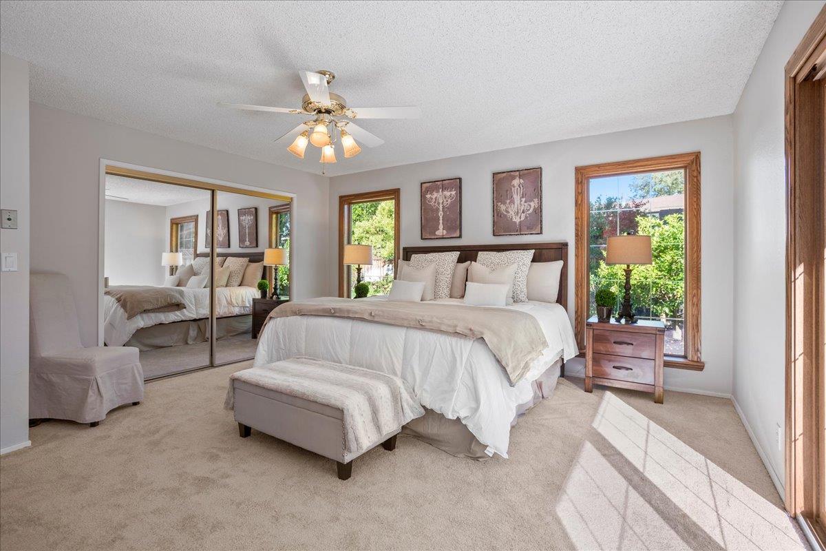1816 Dry Creek Road San Jose, CA 95124 - Photo 17 of 37 a spacious bedroom with a bed couch and a large window