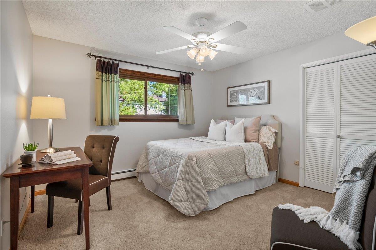 1816 Dry Creek Road San Jose, CA 95124 - Photo 20 of 37 a bedroom with a bed and a chandelier