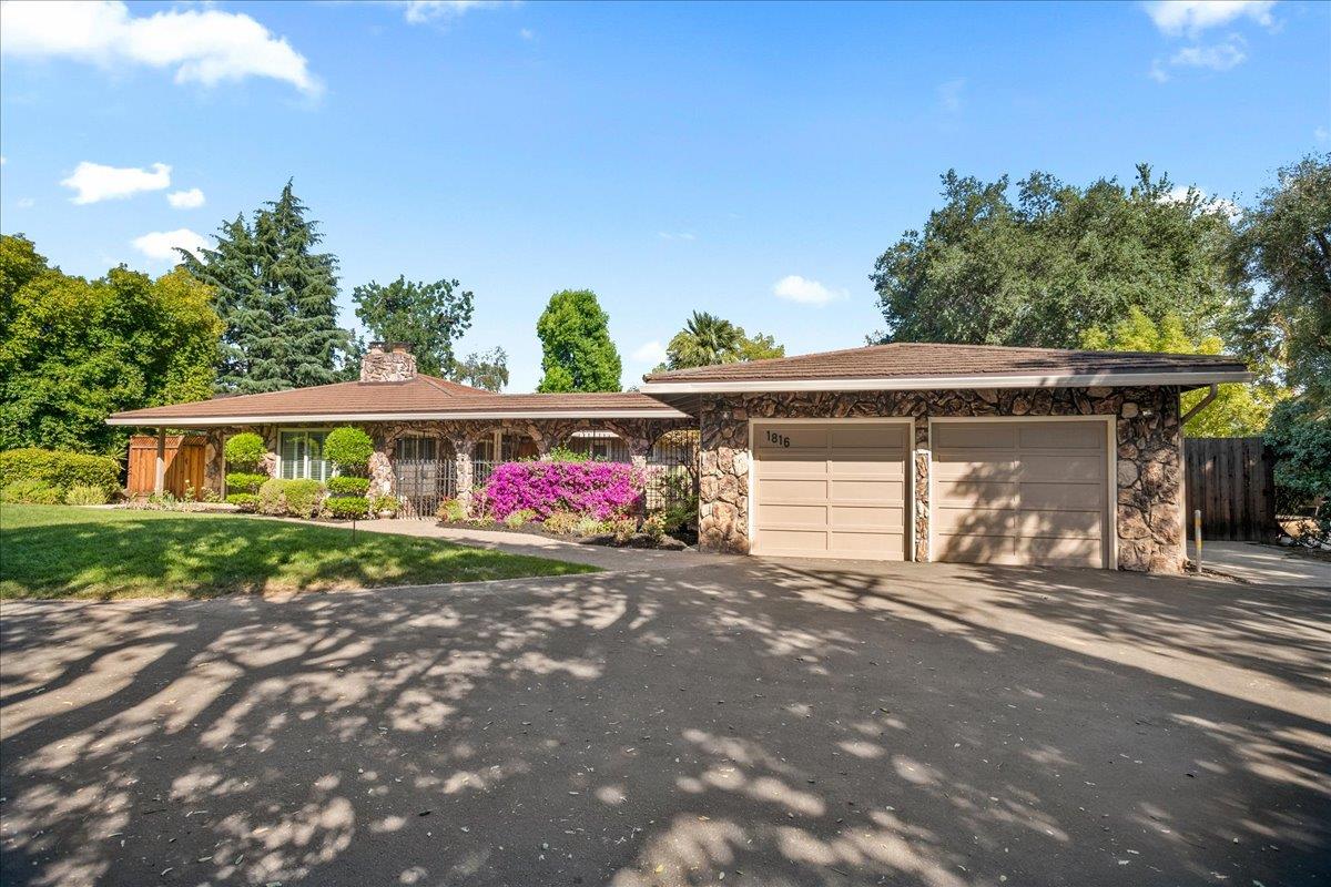 1816 Dry Creek Road San Jose, CA 95124 - Photo 2 of 37 a front view of a house with a yard and garage
