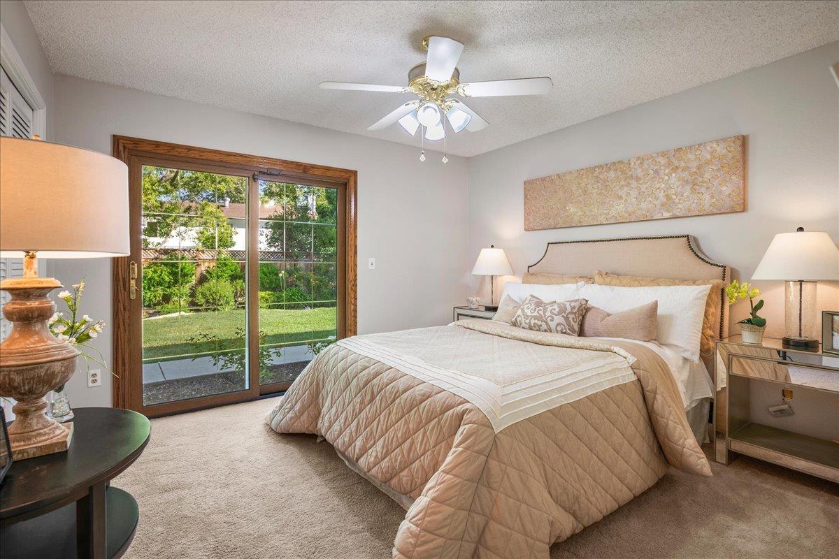 1816 Dry Creek Road San Jose, CA 95124 - Photo 21 of 37 a spacious bedroom with a bed and a large window