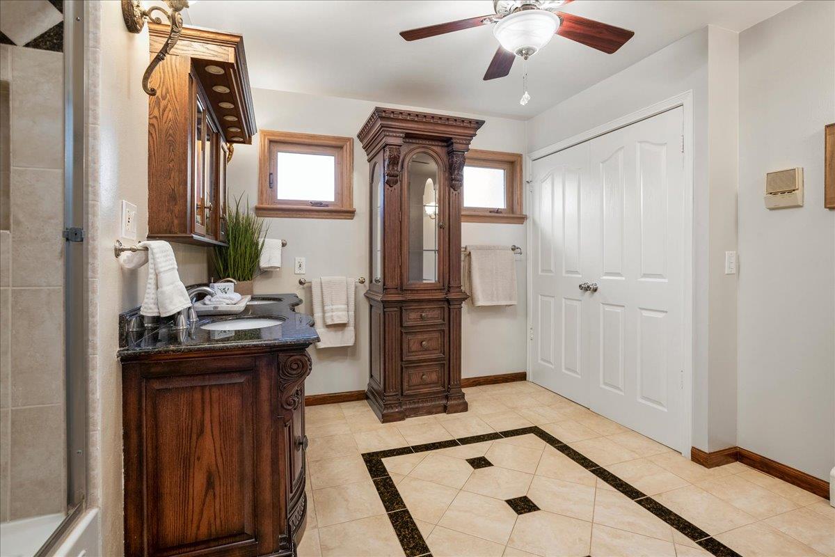 1816 Dry Creek Road San Jose, CA 95124 - Photo 22 of 37 a bathroom with a sink a vanity and mirror
