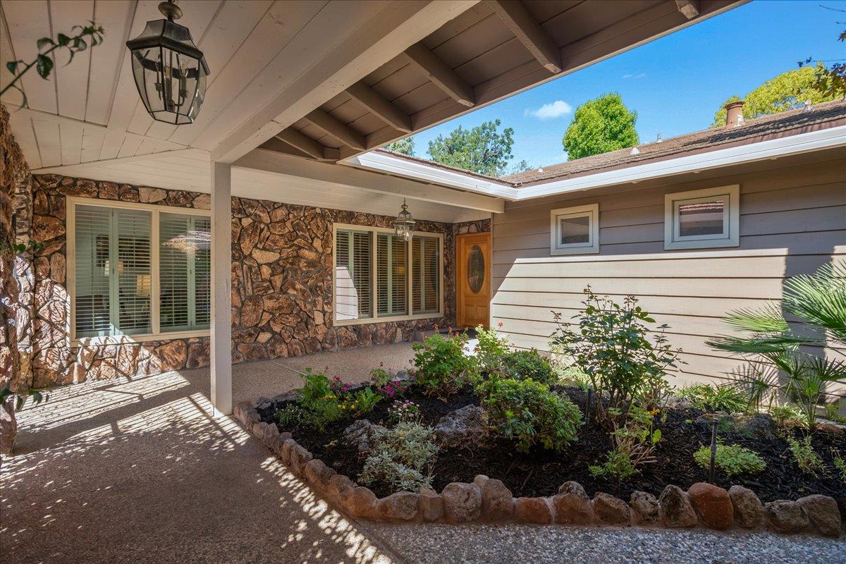 1816 Dry Creek Road San Jose, CA 95124 - Photo 4 of 37 a potted plant sitting in front of a house