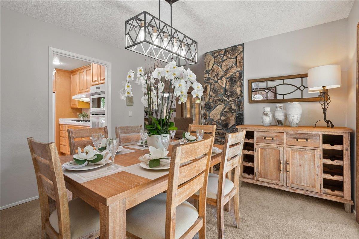 1816 Dry Creek Road San Jose, CA 95124 - Photo 10 of 37 a view of a dining room with furniture and chandelier