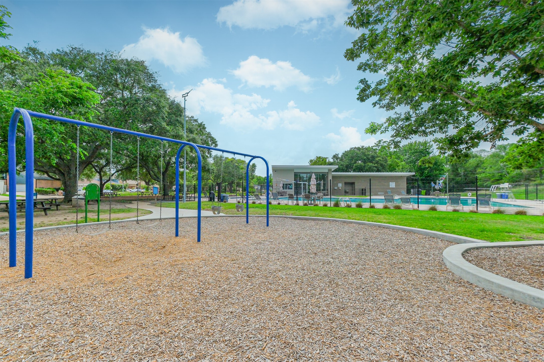 1007 Arrow Hill Road Houston, TX 77077 - Photo 46 of 50 a view of a park with swings