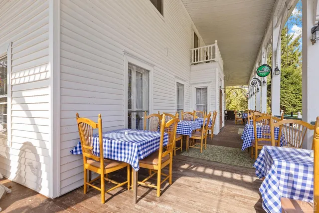 a bedroom with two beds and a chair