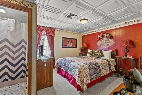 a bedroom with a bed and a table