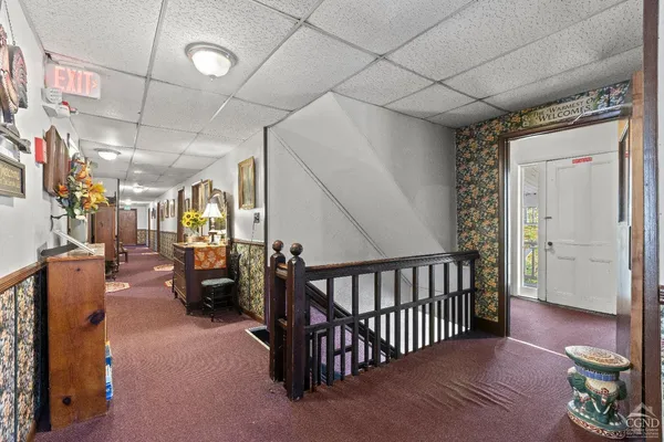 a bedroom with a bed and large mirror