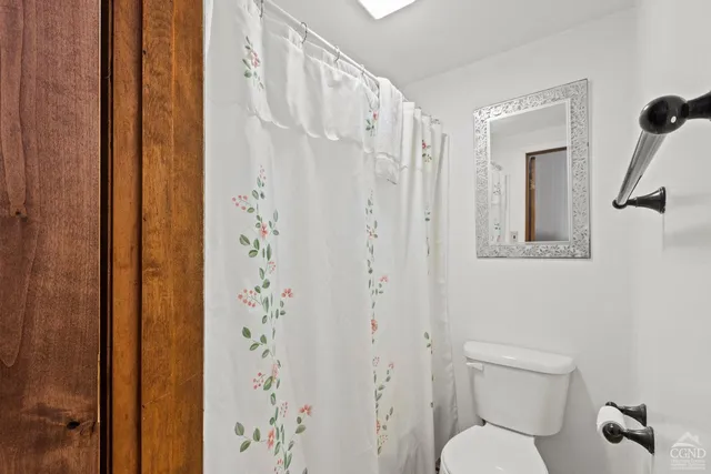 a bed room with a bed and a window