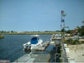 11 East Pimlico Road Tuckerton, NJ 08087 - Photo 2 of 3 a view of a lake with a table and chairs