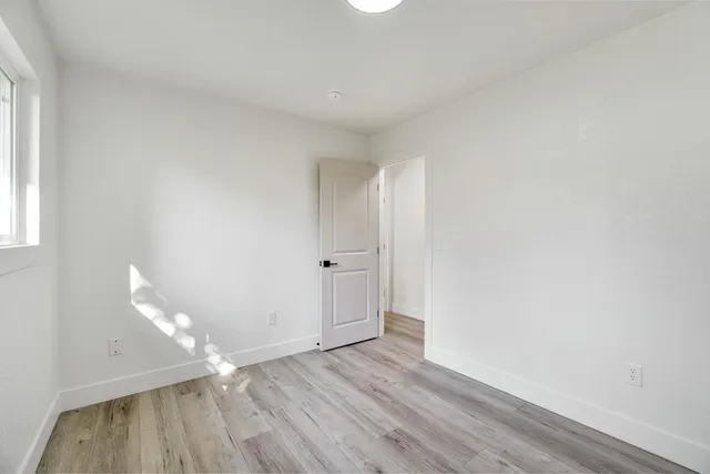 a bathroom with a bathtub shower sink vanity and a toilet