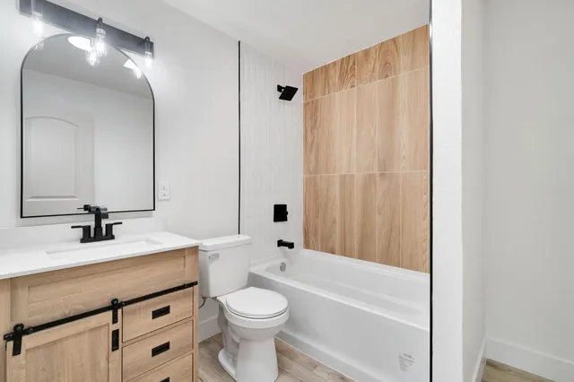 a bathroom with a bathtub and shower