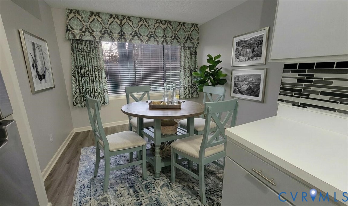 1501 Bronwyn Road, Unit 202 Henrico, VA 23238 - Photo 11 of 22 a dining room with furniture and window