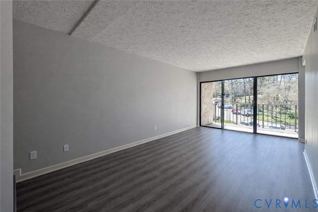 1501 Bronwyn Road, Unit 202 Henrico, VA 23238 - Photo 2 of 22 wooden floor in an empty room with a window