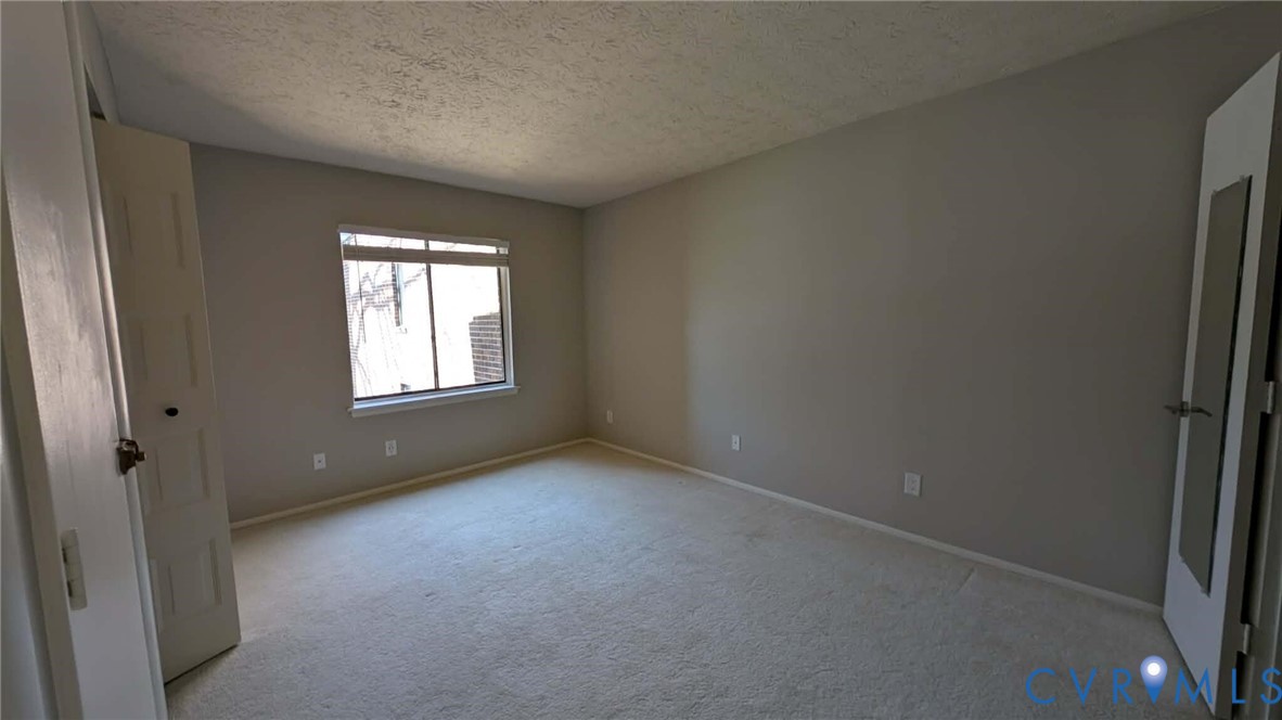 1501 Bronwyn Road, Unit 202 Henrico, VA 23238 - Photo 6 of 22 an empty room with windows