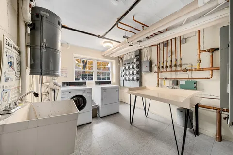 a view of a kitchen with furniture and a stove