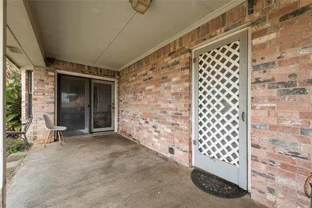 a bedroom with a bed and a night stand
