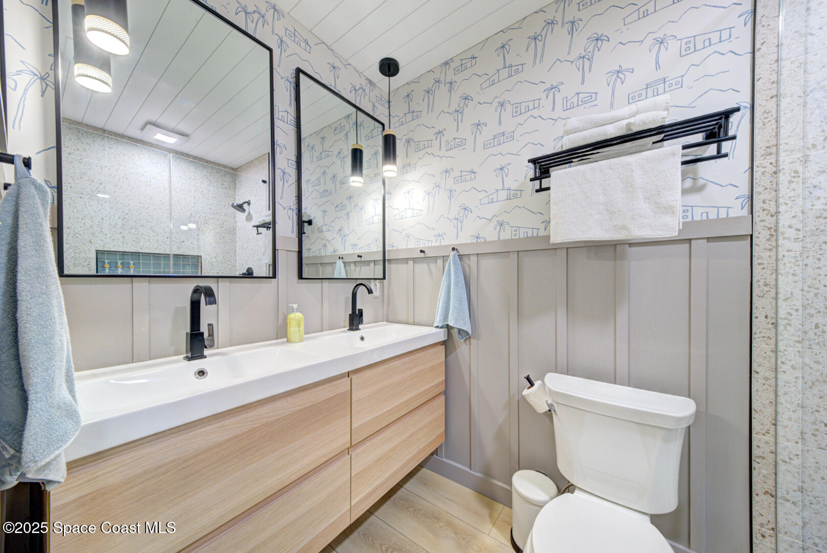 911 Bali Road Cocoa Beach, FL 32931 - Photo 11 of 66 a bathroom with a sink a toilet and shower