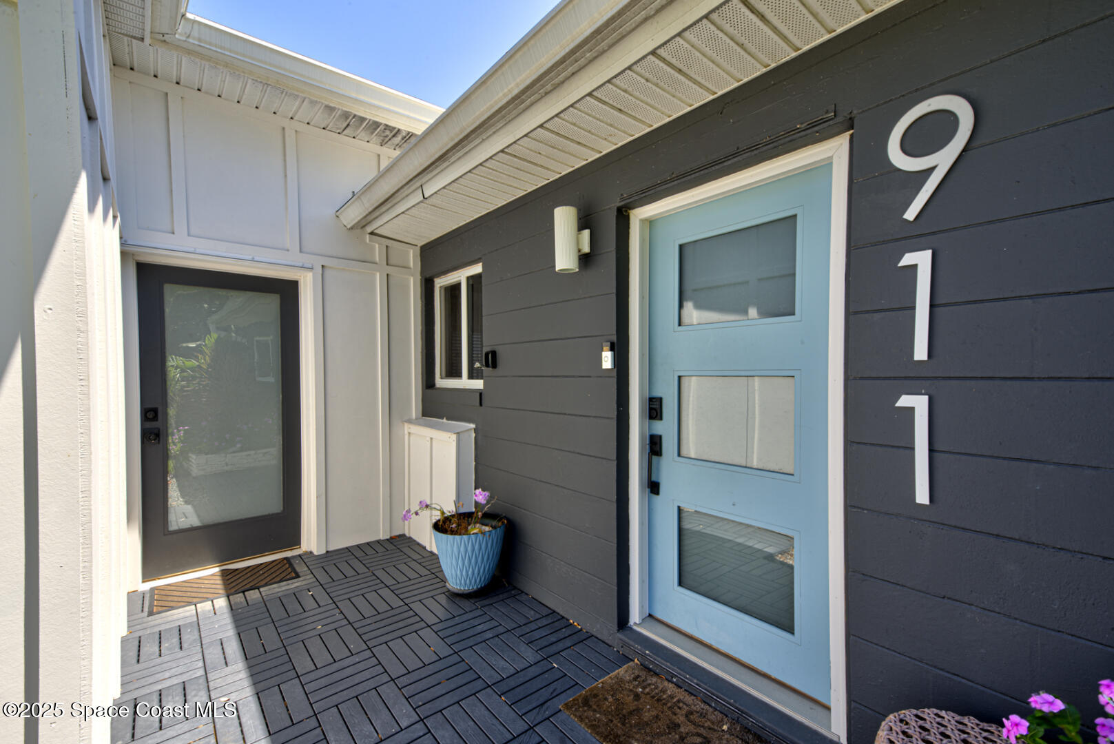 911 Bali Road Cocoa Beach, FL 32931 - Photo 27 of 66 front door & door to garage