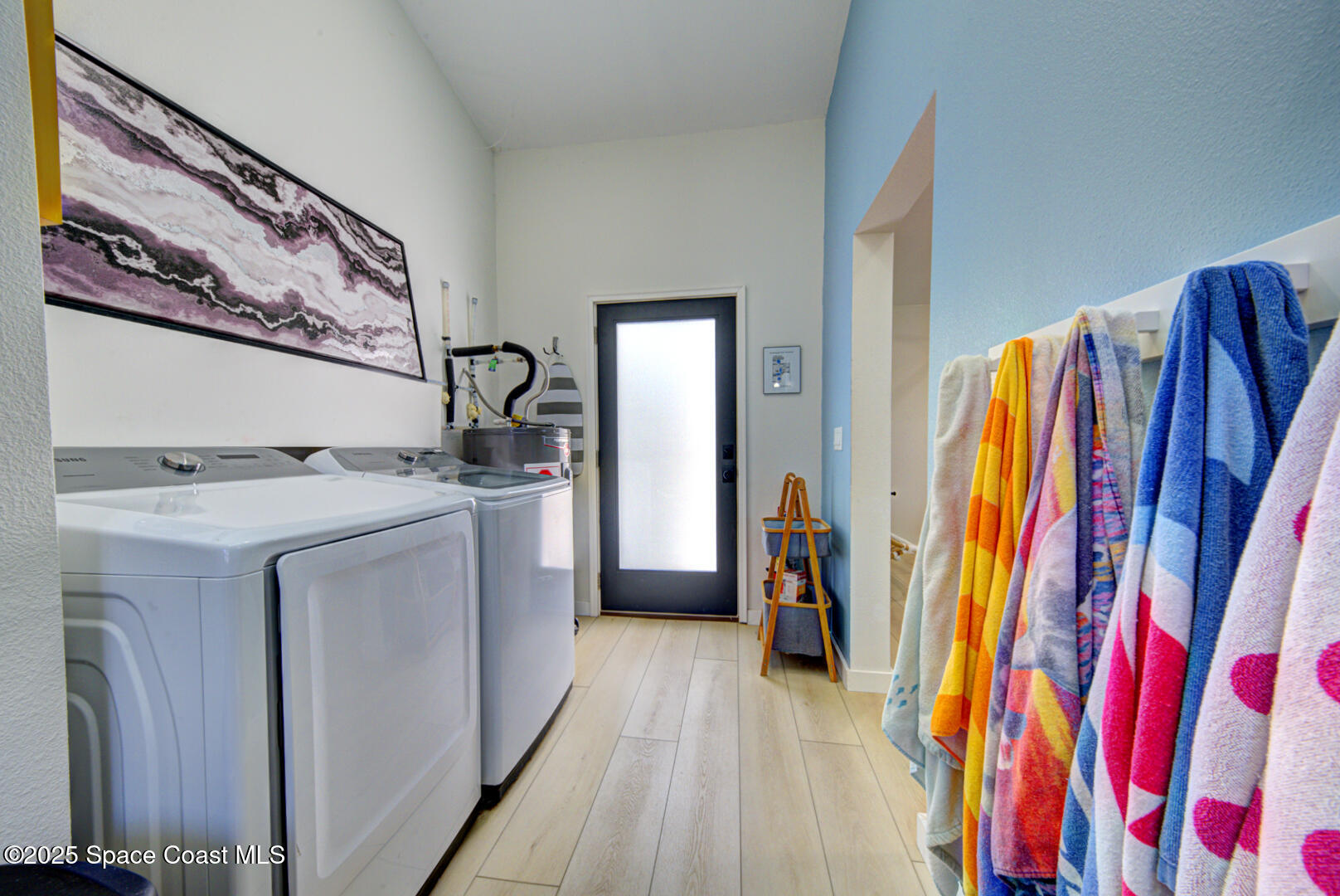 911 Bali Road Cocoa Beach, FL 32931 - Photo 45 of 66 a utility room with dryer and washer