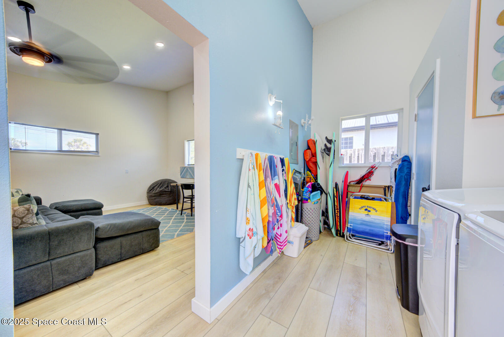 911 Bali Road Cocoa Beach, FL 32931 - Photo 46 of 66 a living room with furniture and a flat screen tv