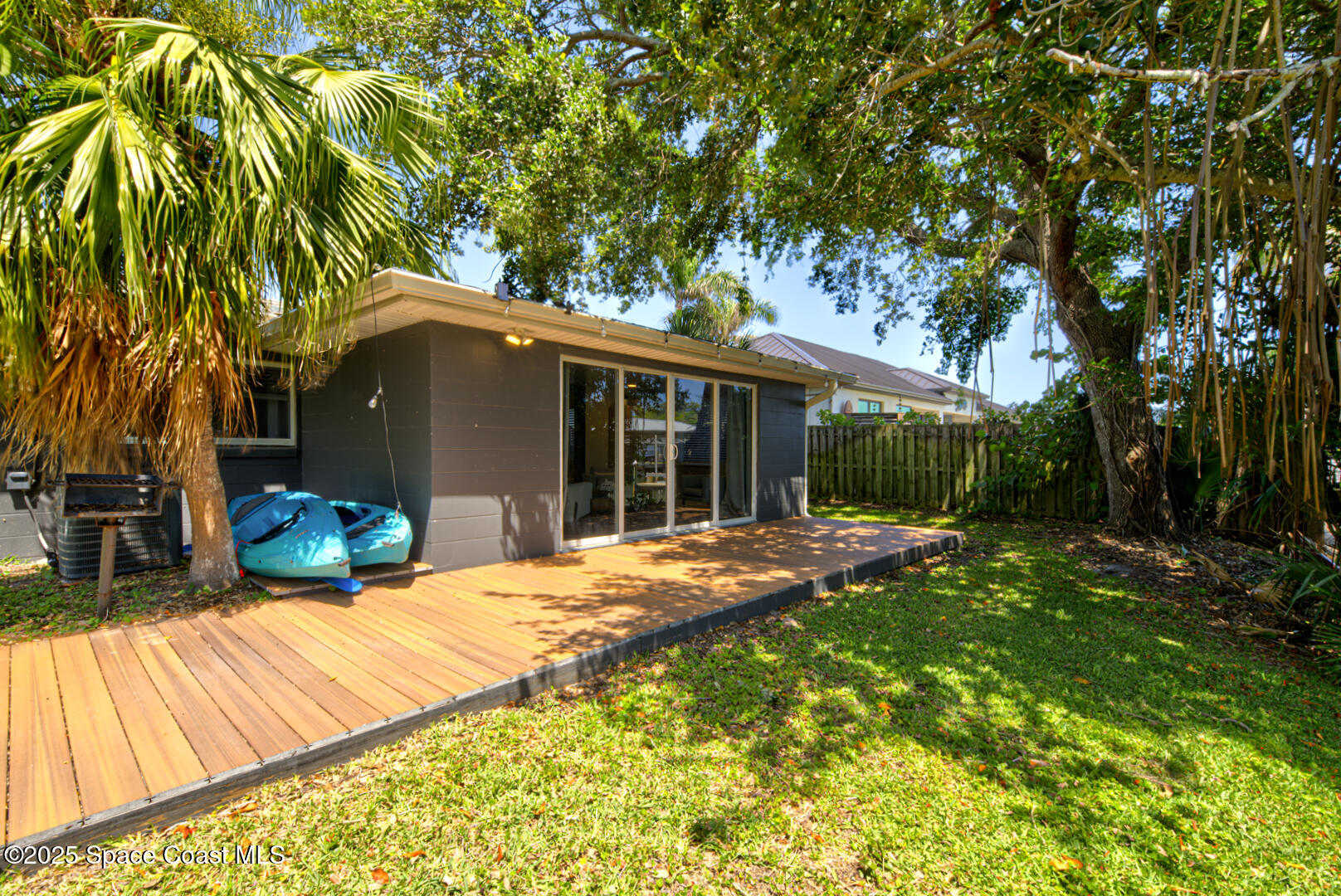 911 Bali Road Cocoa Beach, FL 32931 - Photo 6 of 66 a view of a house with backyard