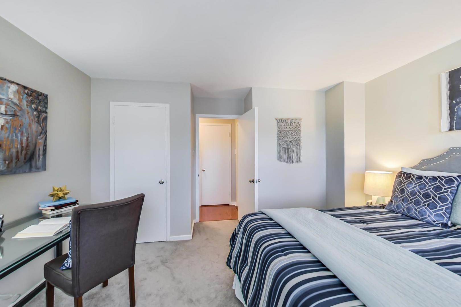 2909 North Sheridan Road, Unit 712 Chicago, IL 60657 - Photo 12 of 16 a bedroom with bed and a couch