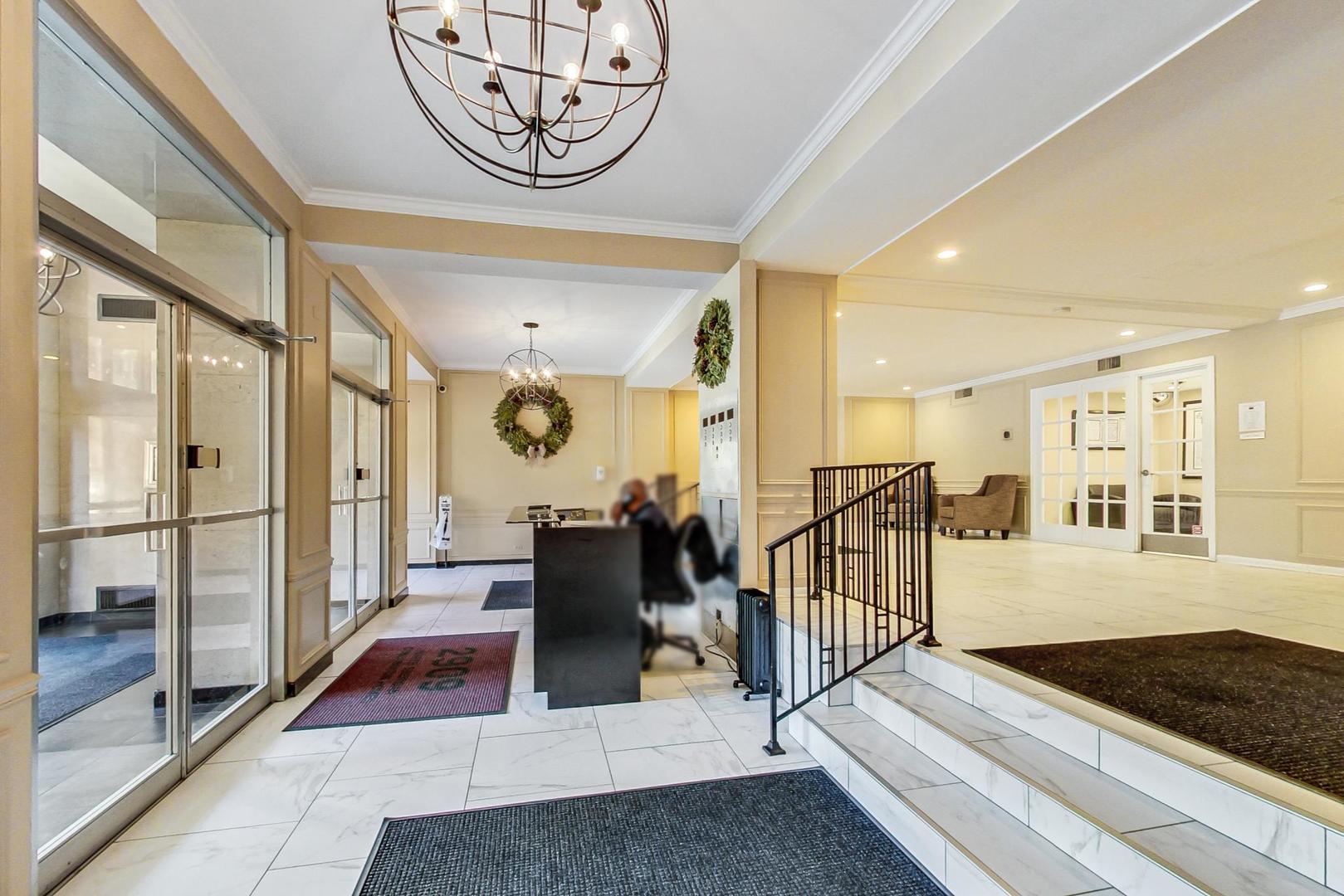 2909 North Sheridan Road, Unit 712 Chicago, IL 60657 - Photo 3 of 16 a very nice looking living room with a dining table