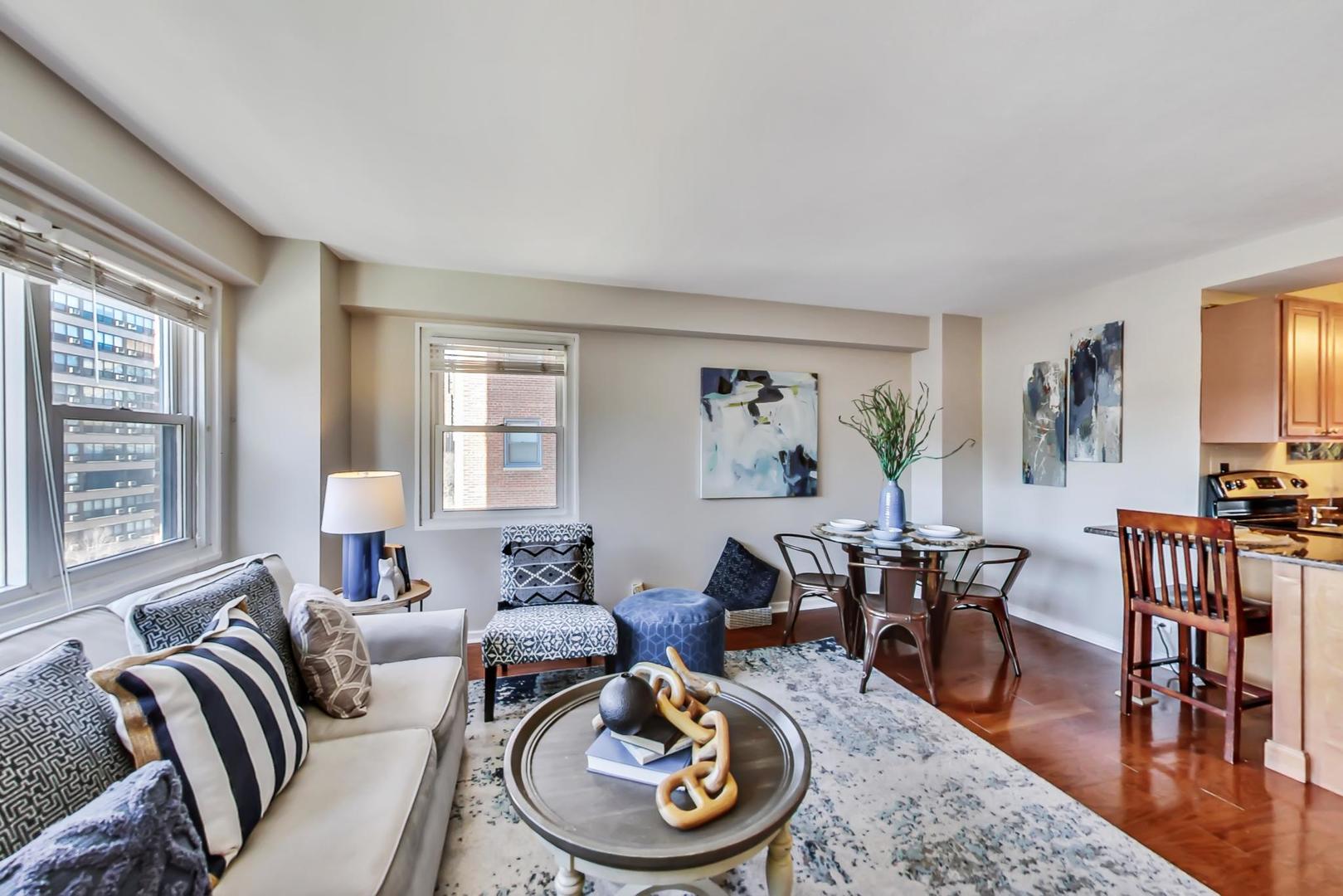 2909 North Sheridan Road, Unit 712 Chicago, IL 60657 - Photo 5 of 16 a living room with furniture and a wooden floor