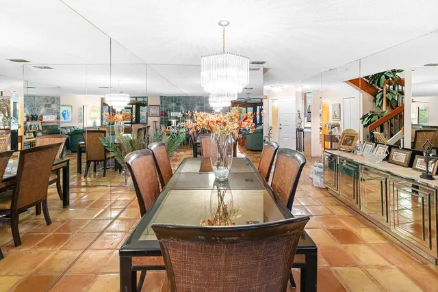 a living room with lots of furniture and a large window