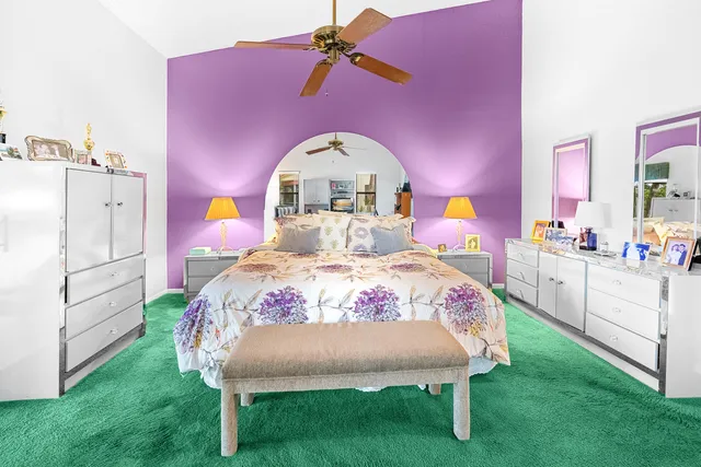 a view of a swimming pool with a garden and plants