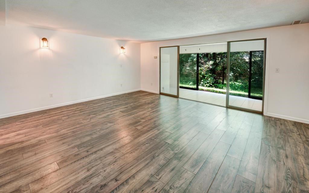 376 Great Road, Unit 15 Acton, MA 01720 - Photo 16 of 27 a view of a room with wooden floor and fan
