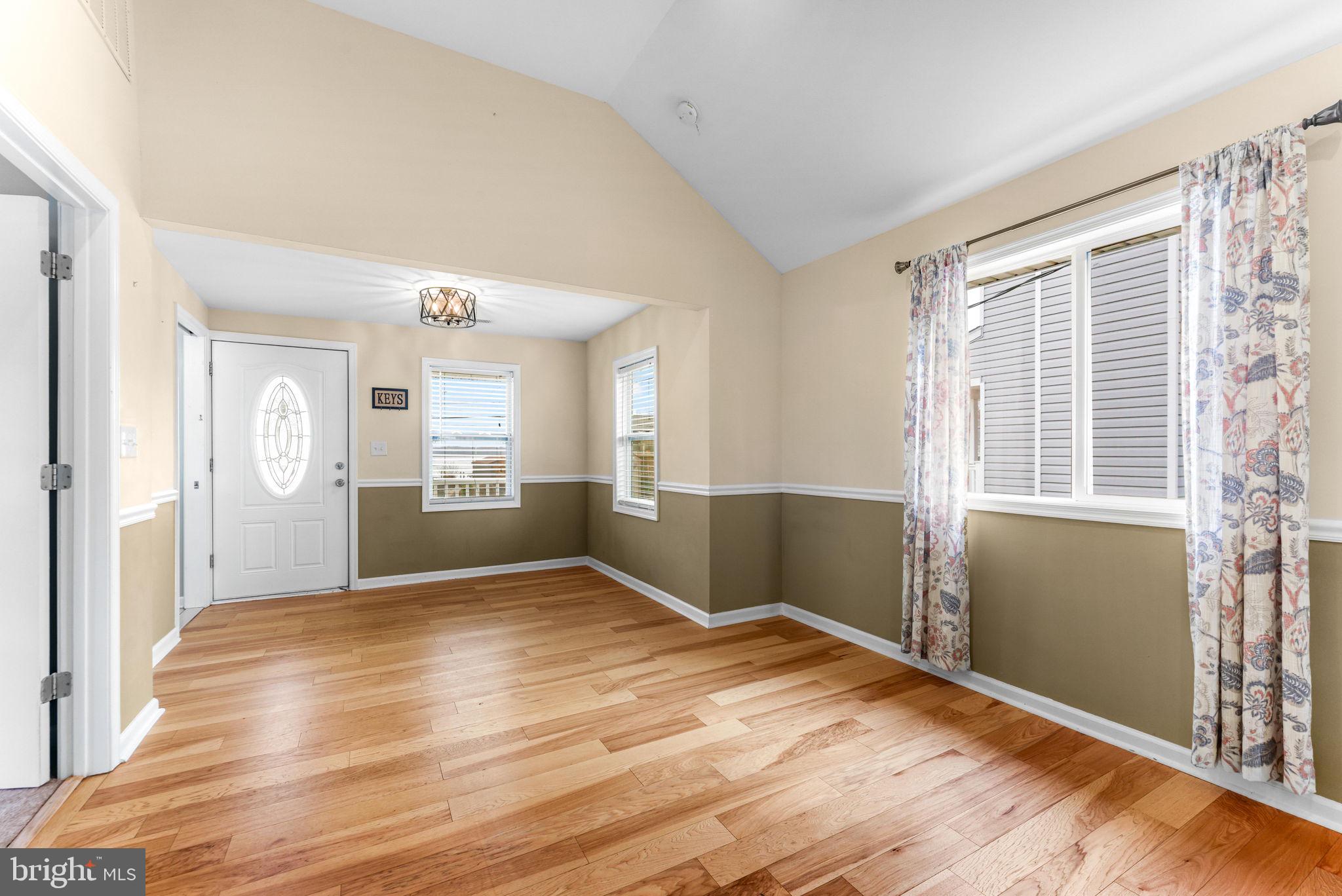 7343 Greenbank Road Baltimore, MD 21220 - Photo 12 of 46 a view of wooden floor and windows in an empty room