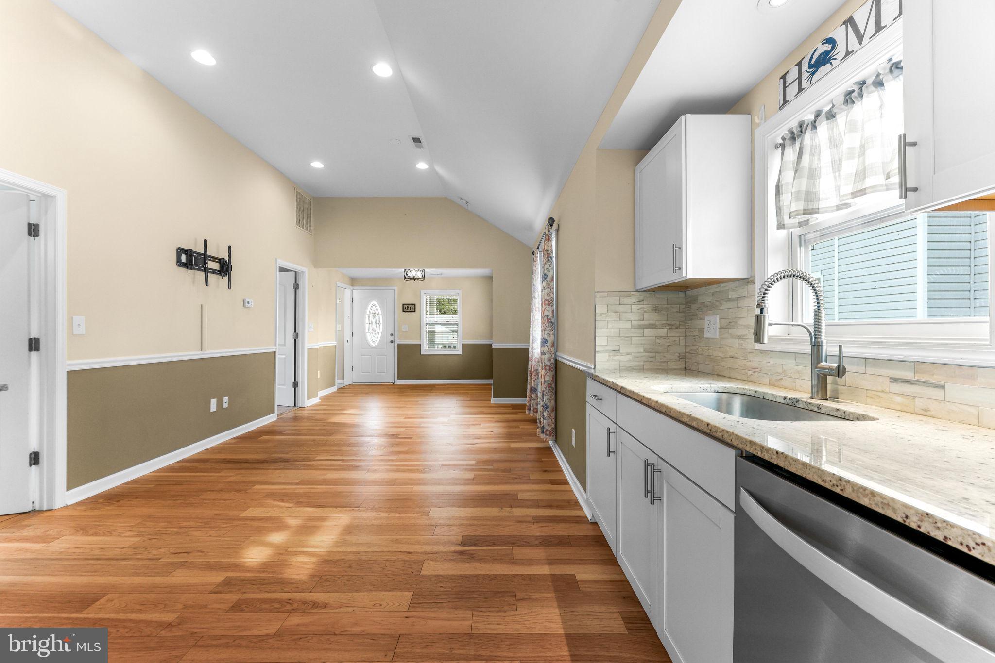 7343 Greenbank Road Baltimore, MD 21220 - Photo 17 of 46 a view of a kitchen with kitchen island a sink stainless steel appliances and cabinets