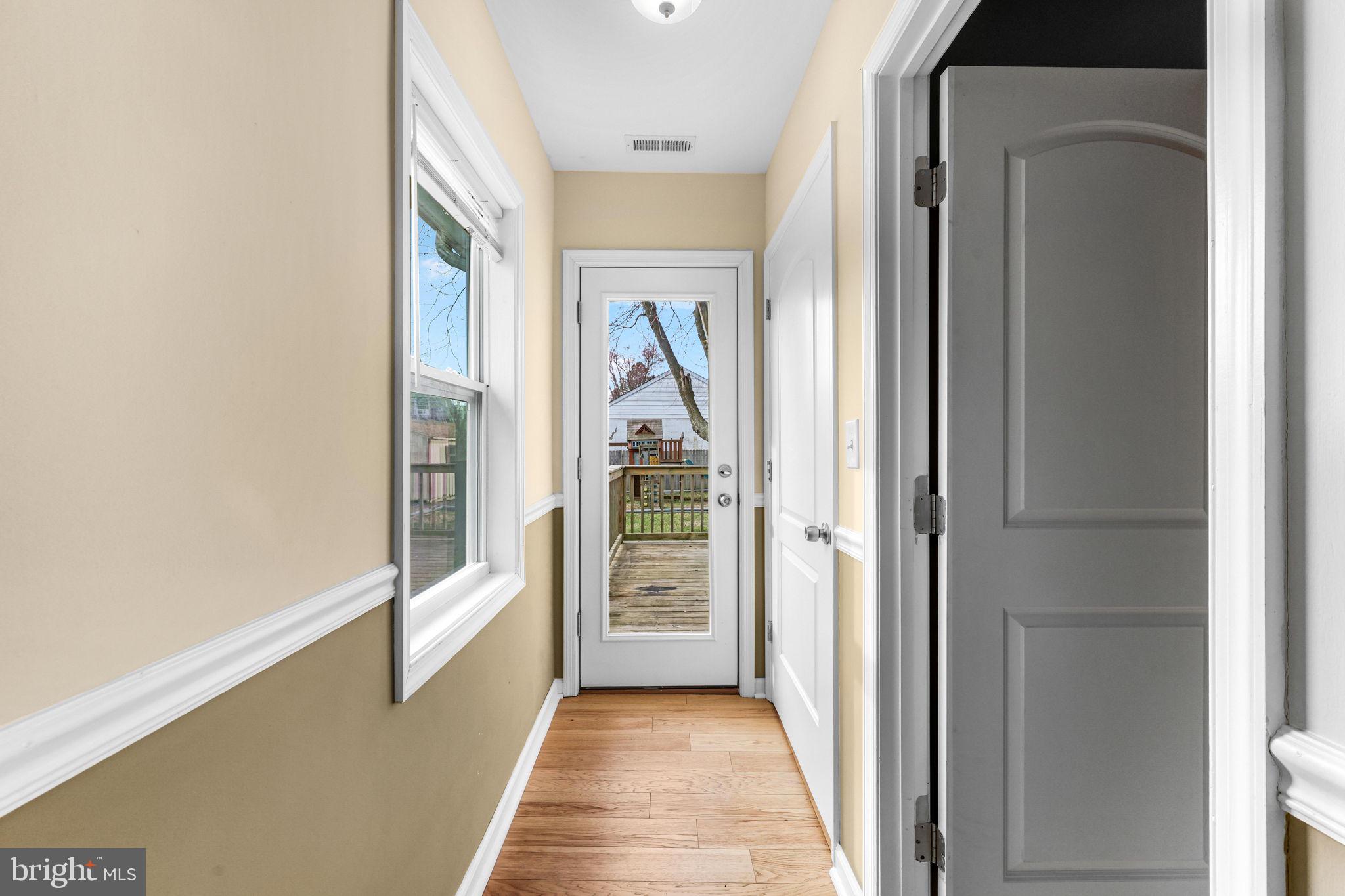 7343 Greenbank Road Baltimore, MD 21220 - Photo 18 of 46 a view of a hallway view with wooden floor and staircase