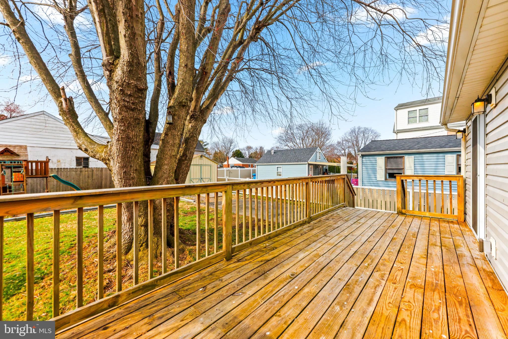 7343 Greenbank Road Baltimore, MD 21220 - Photo 31 of 46 a view of a balcony with wooden floor and fence