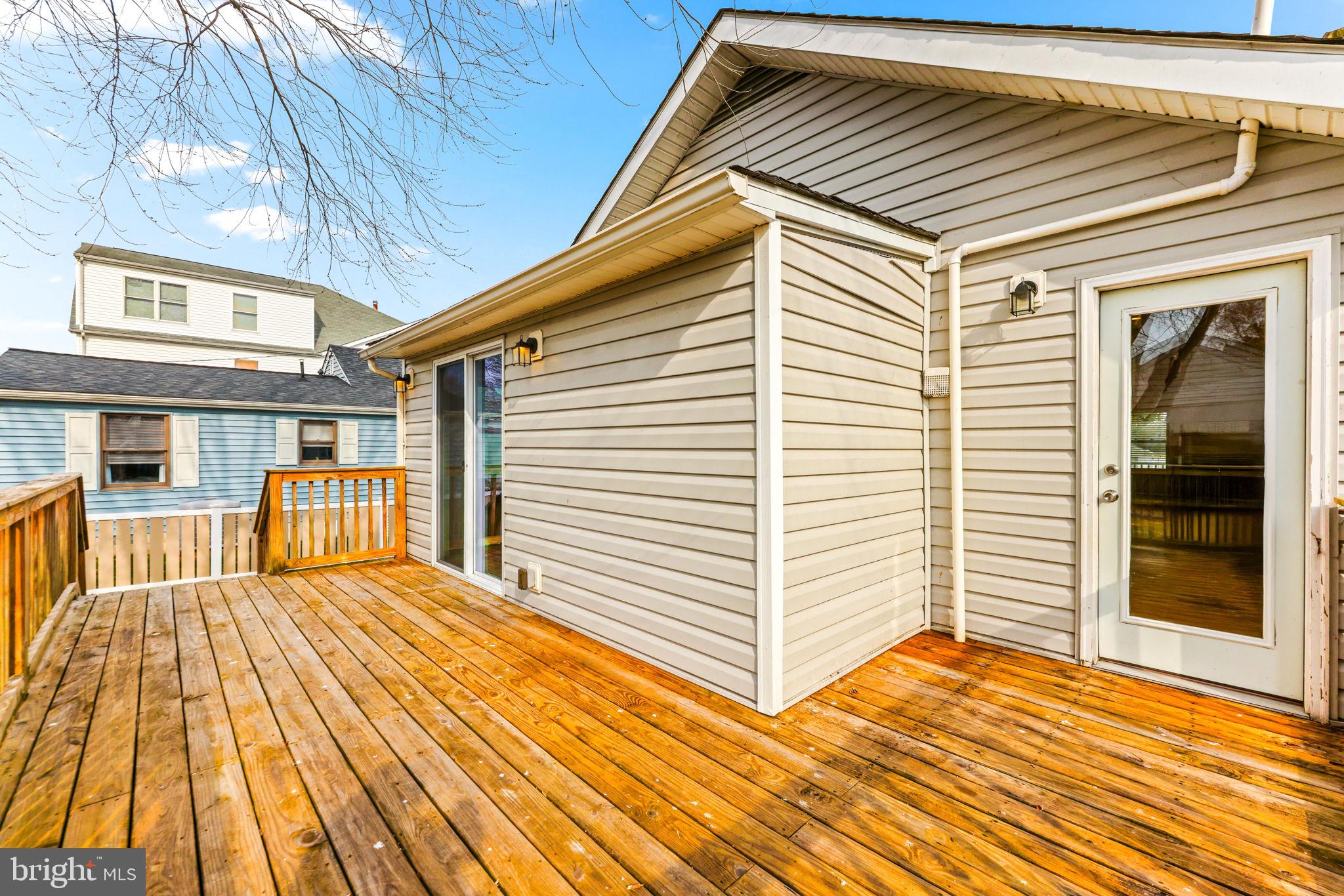 7343 Greenbank Road Baltimore, MD 21220 - Photo 32 of 46 a view of backyard with a balcony and wooden floor