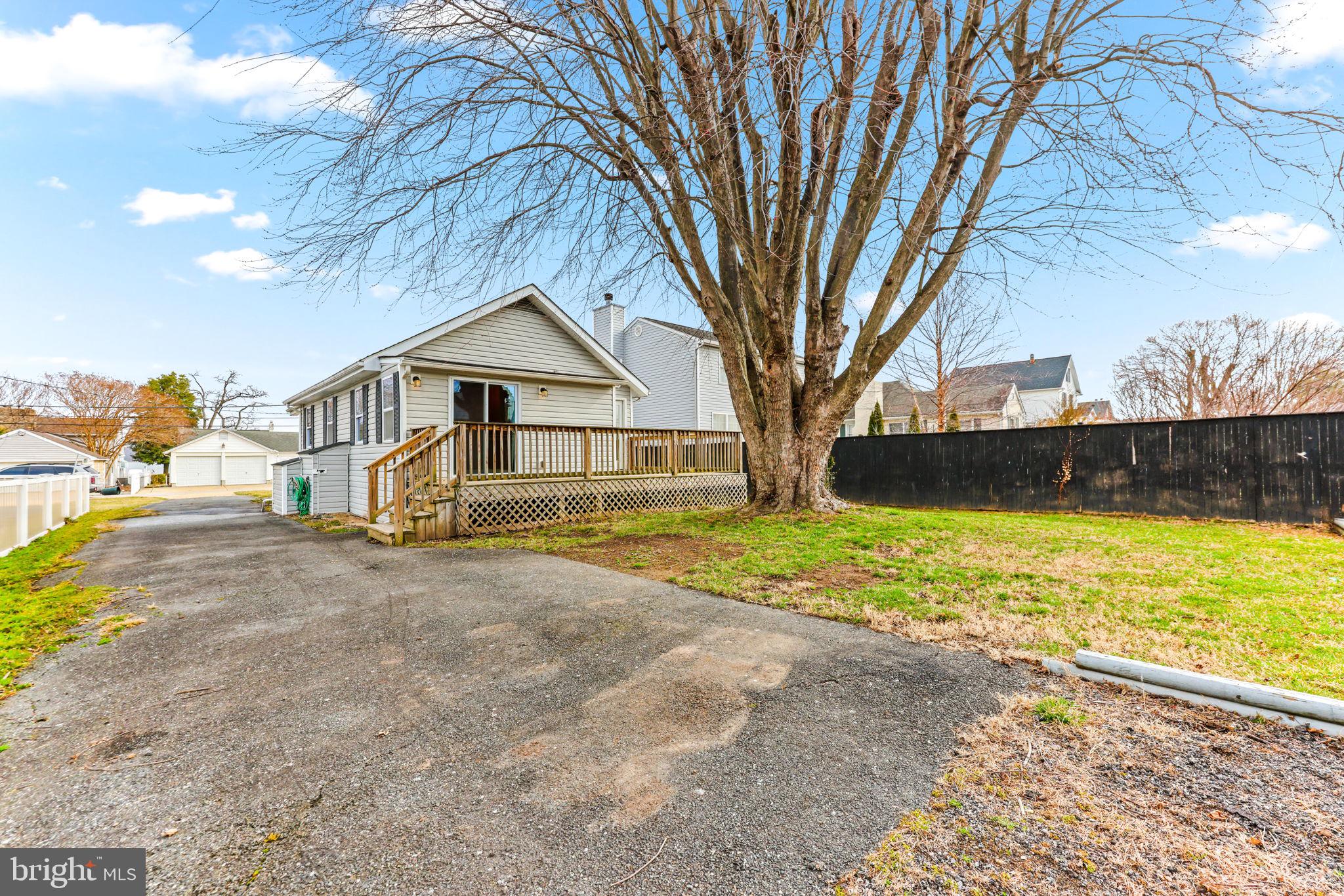 7343 Greenbank Road Baltimore, MD 21220 - Photo 33 of 46 a front view of a house with garden