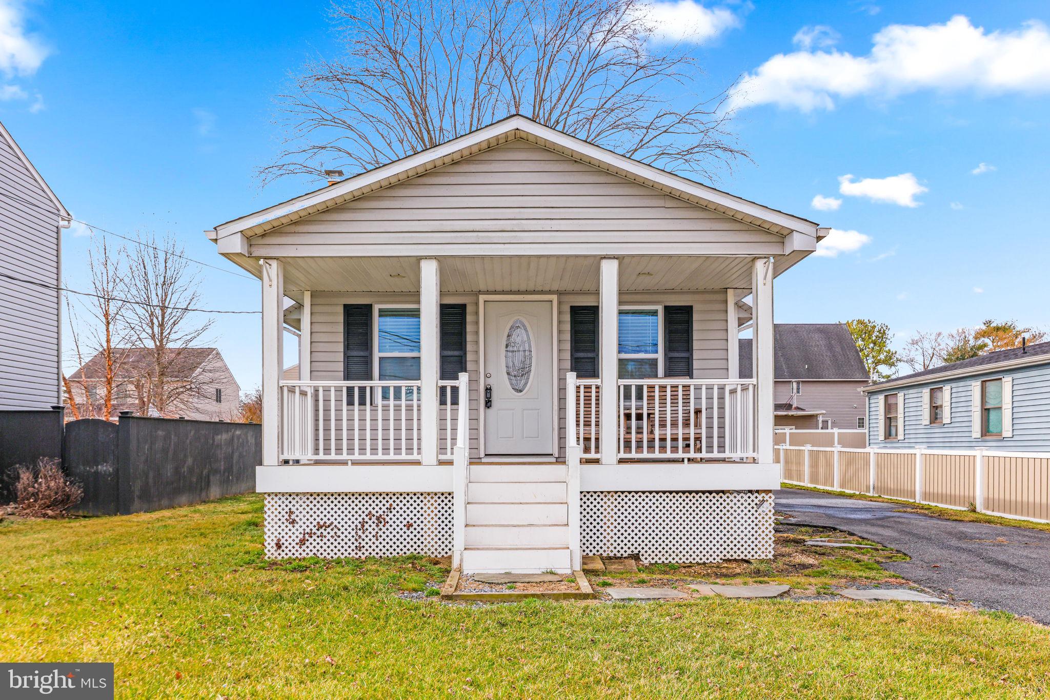 7343 Greenbank Road Baltimore, MD 21220 - Photo 5 of 46 a front view of a house with a yard